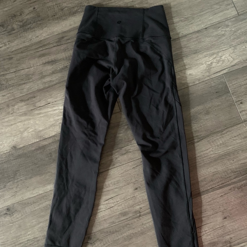 Lululemon black leggings with details on legs